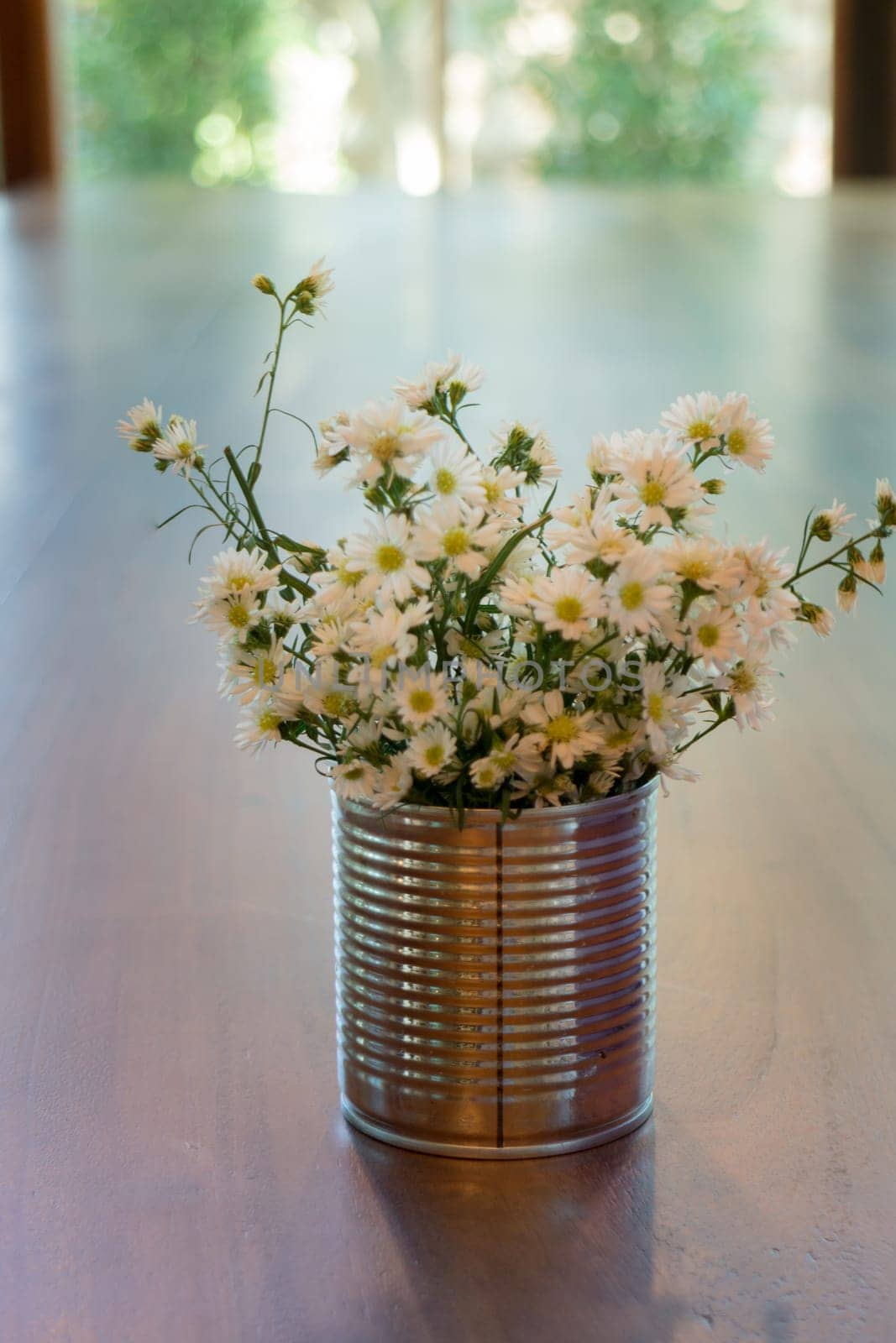 Vintage white flower pot on wooden table, stock photo