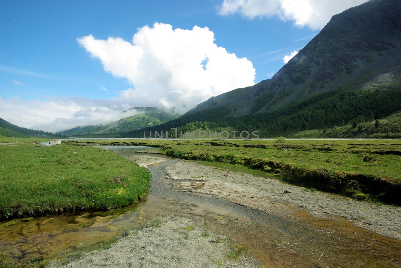Mountain landscape. Highlands, the mountain peaks, gorges and valleys. The stones on the slopes.
