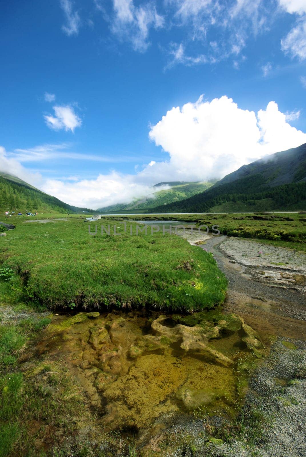 Mountain landscape. Highlands, the mountain peaks, gorges and valleys. The stones on the slopes.