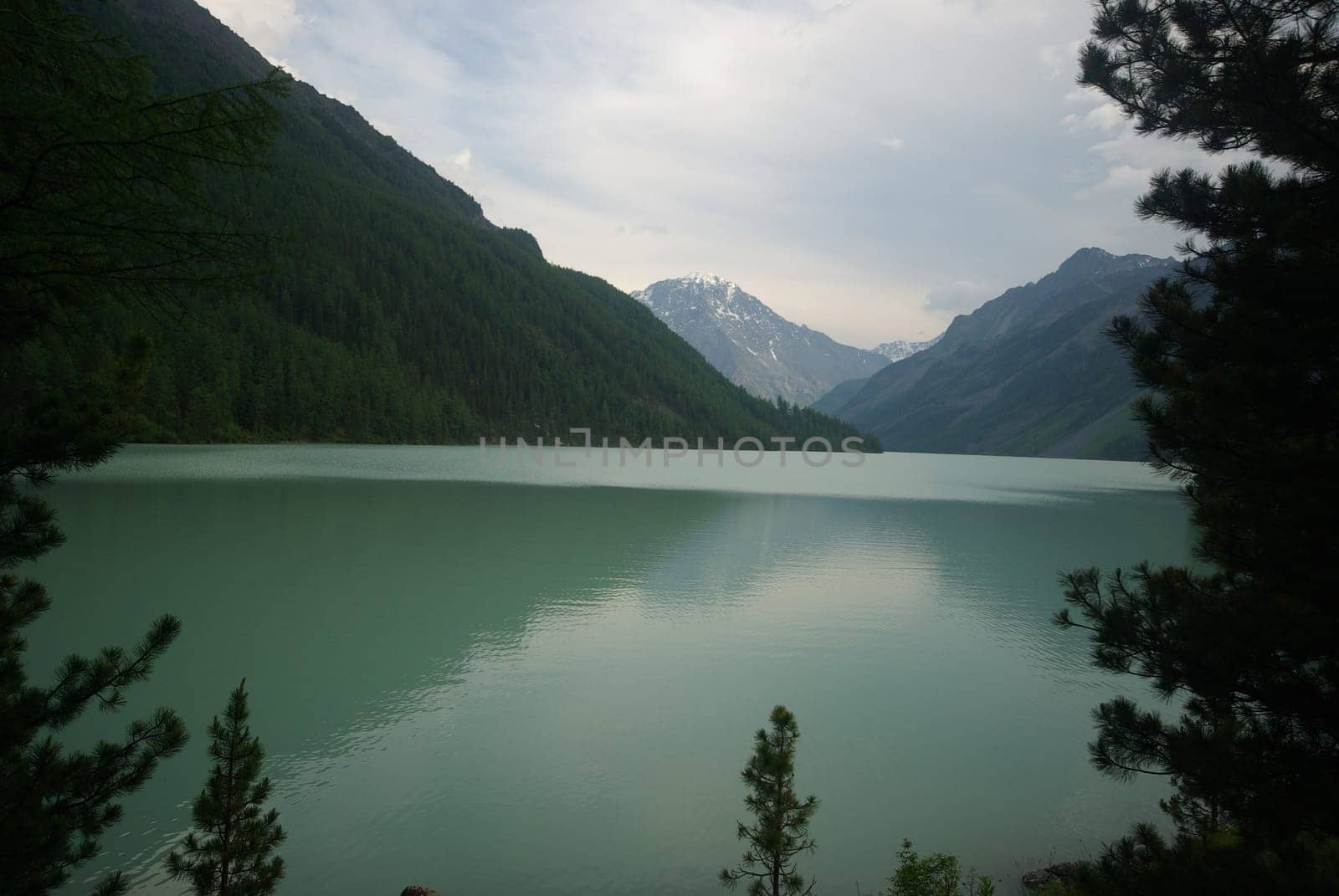 Beautiful mountain landscape near the lake. Mountain Lake. Kind of mountainous terrain and the water in the valley.