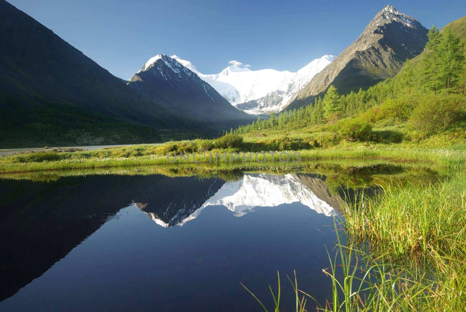 Beautiful mountain landscape near the lake. Mountain Lake. Kind of mountainous terrain and the water in the valley.