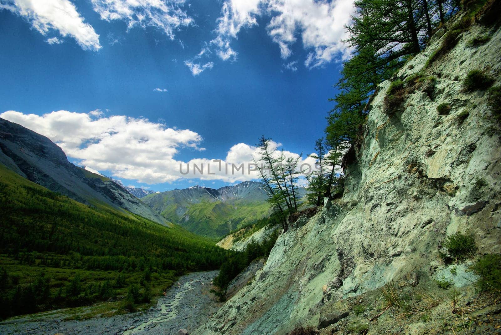 Mountain landscape. Highlands, the mountain peaks, gorges and valleys. The stones on the slopes.
