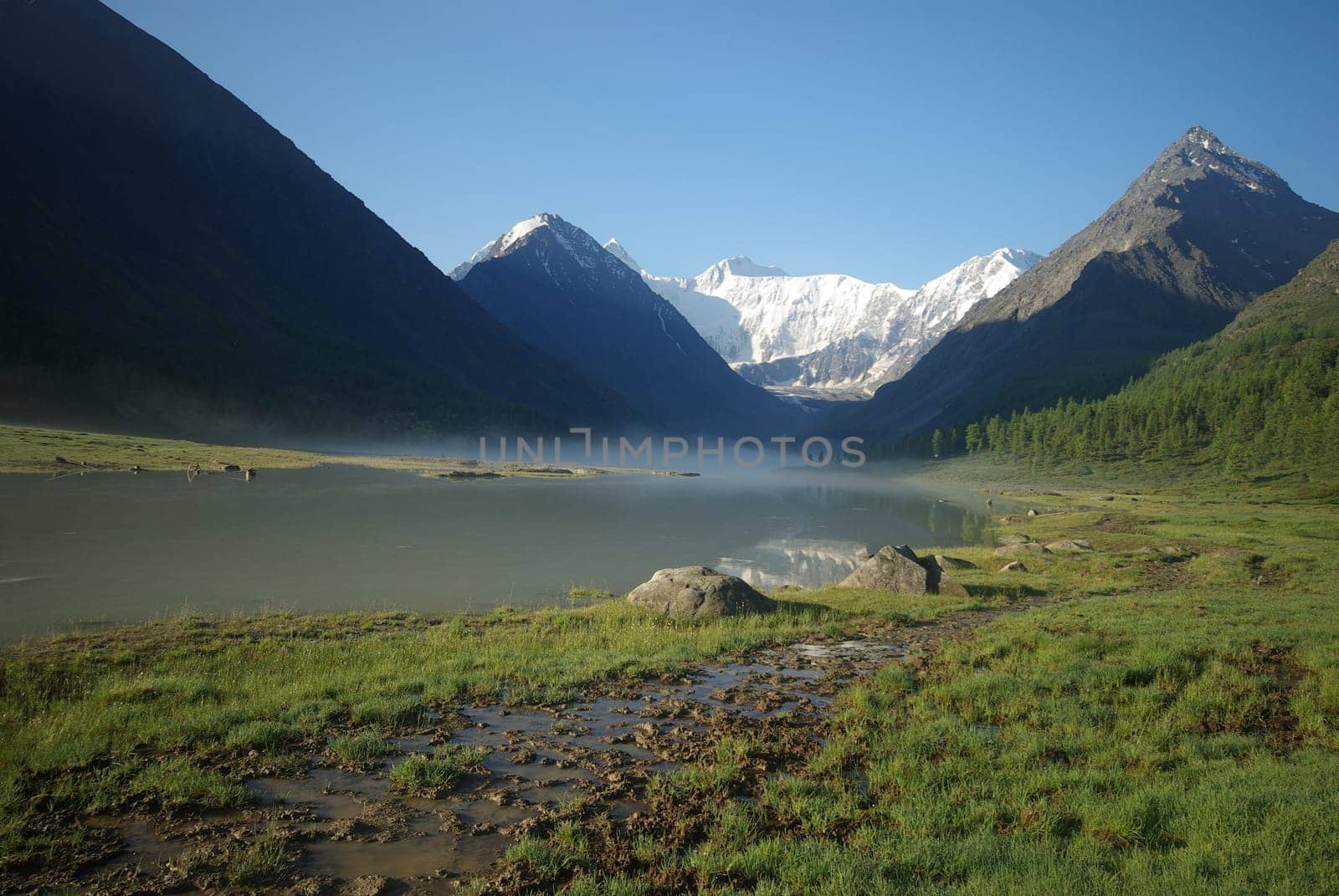 Beautiful mountain landscape near the lake. Mountain Lake. Kind of mountainous terrain and the water in the valley.