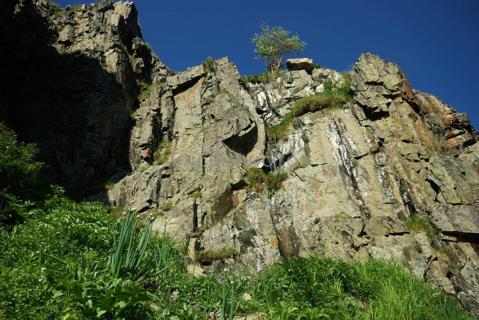 Mountain landscape. Highlands, the mountain peaks, gorges and valleys. The stones on the slopes.