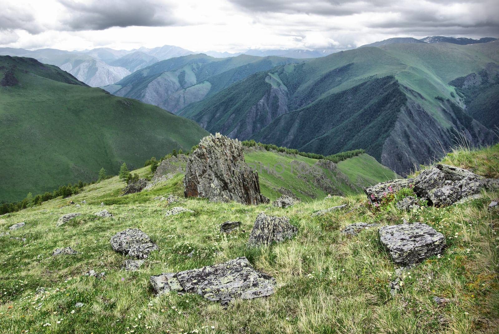Mountain landscape. Highlands, the mountain peaks, gorges and valleys. The stones on the slopes.