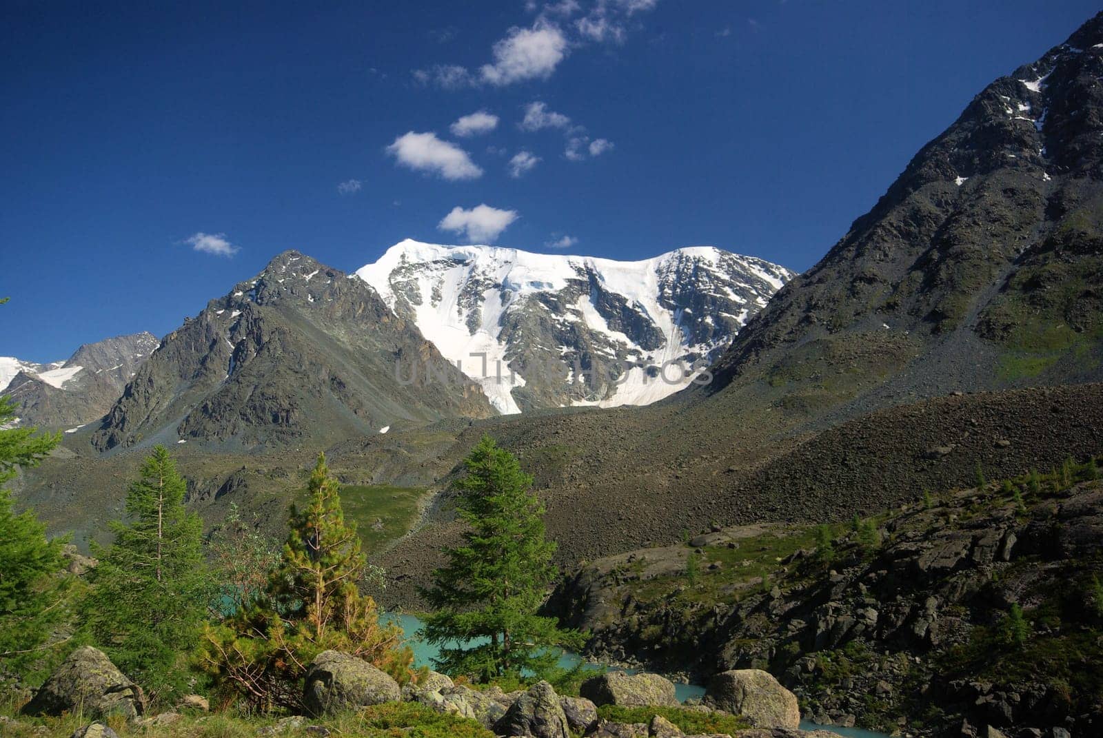 Mountain landscape. Highlands, the mountain peaks, gorges and valleys. The stones on the slopes.
