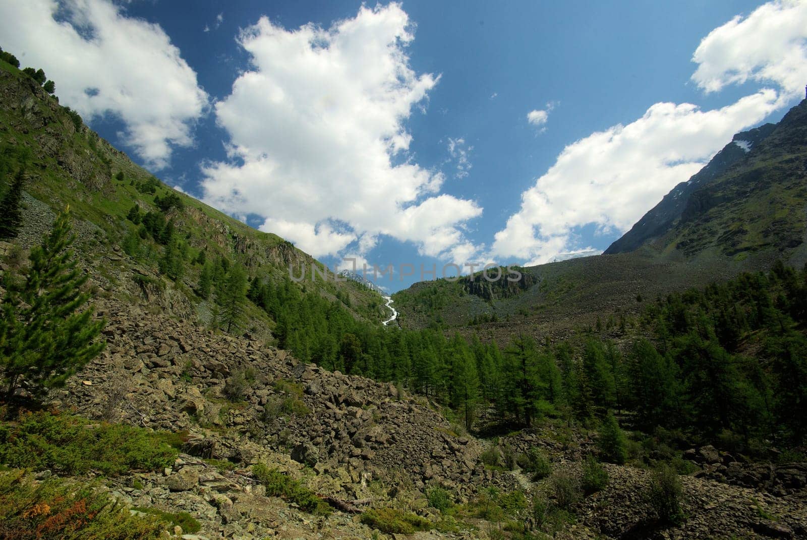 Mountain landscape. Highlands, the mountain peaks, gorges and valleys. The stones on the slopes.