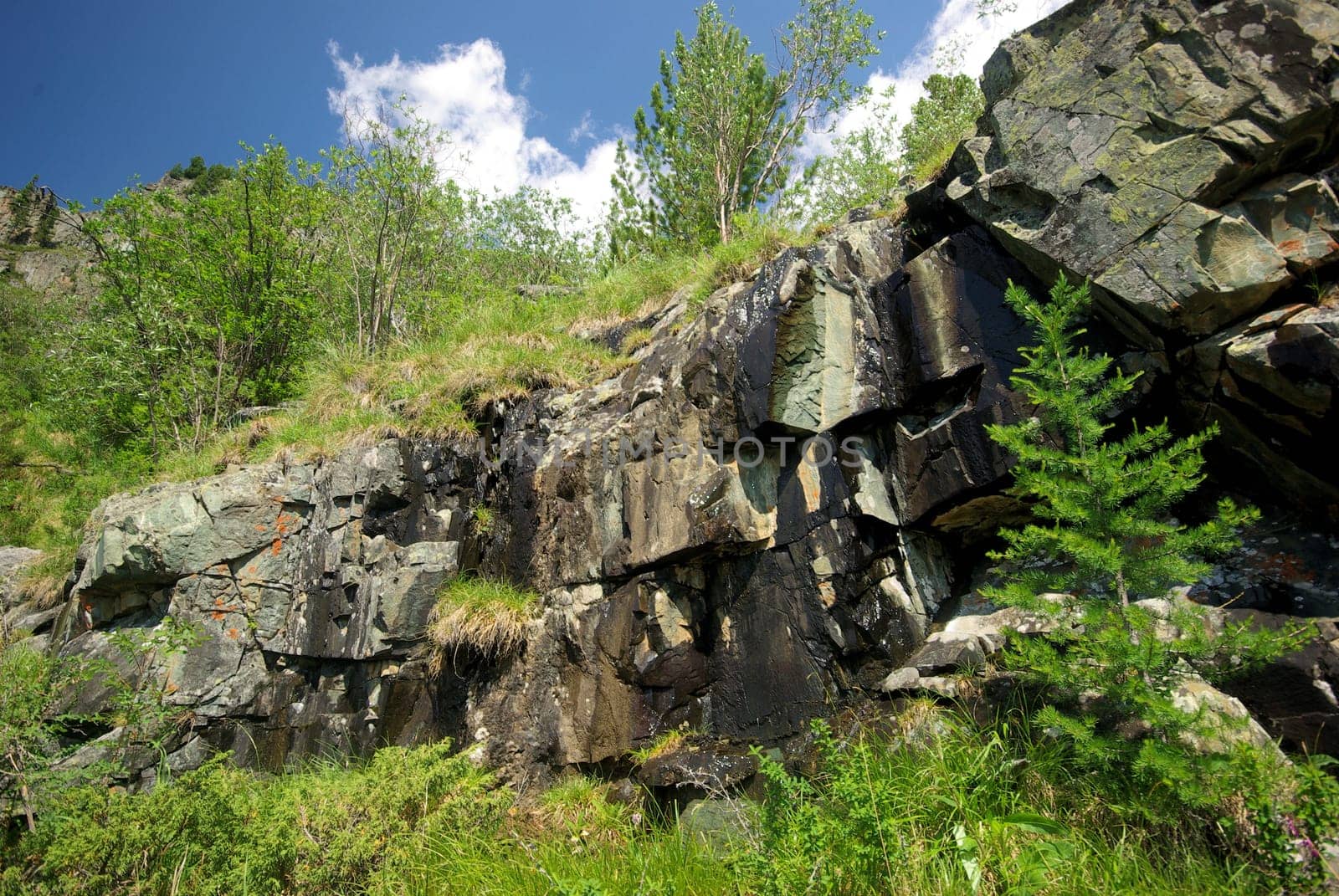 Mountain landscape. Highlands, the mountain peaks, gorges and valleys. The stones on the slopes.