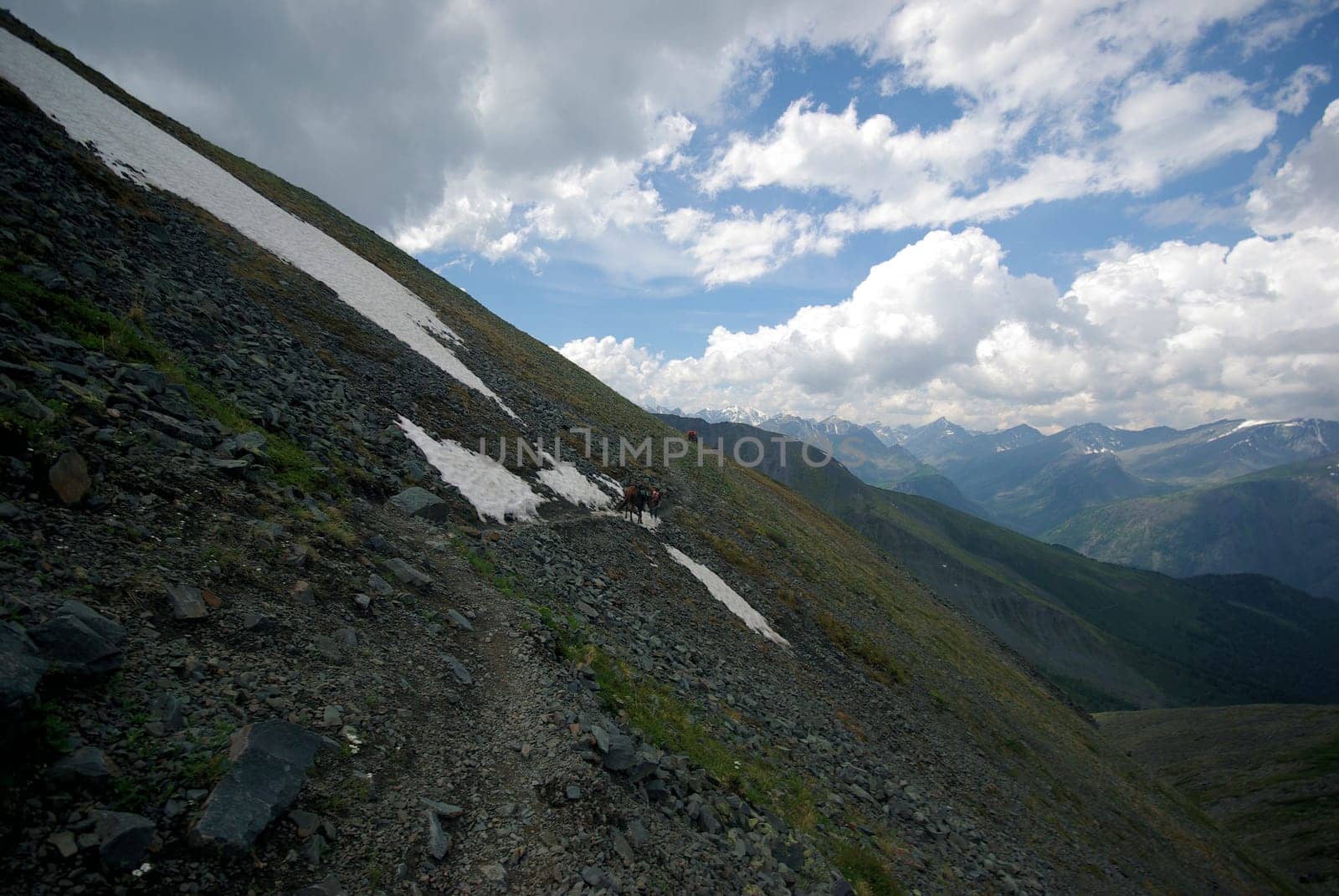 Mountain landscape. Highlands, the mountain peaks, gorges and valleys. The stones on the slopes.