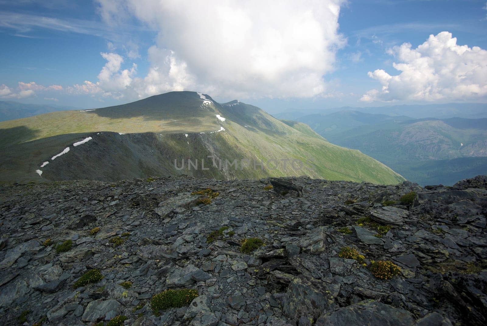 Mountain landscape. Highlands, the mountain peaks, gorges and valleys. The stones on the slopes.
