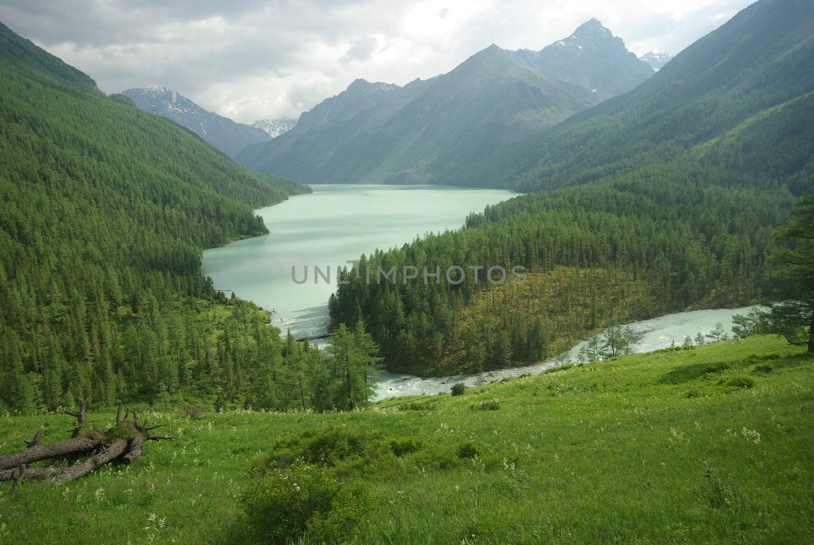 Beautiful mountain landscape near the lake. Mountain Lake. Kind of mountainous terrain and the water in the valley.
