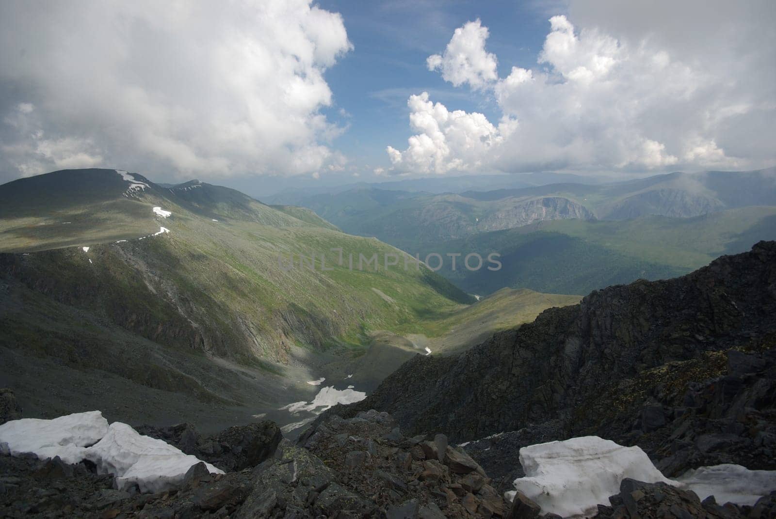 Mountain landscape. Highlands, the mountain peaks, gorges and valleys. The stones on the slopes.
