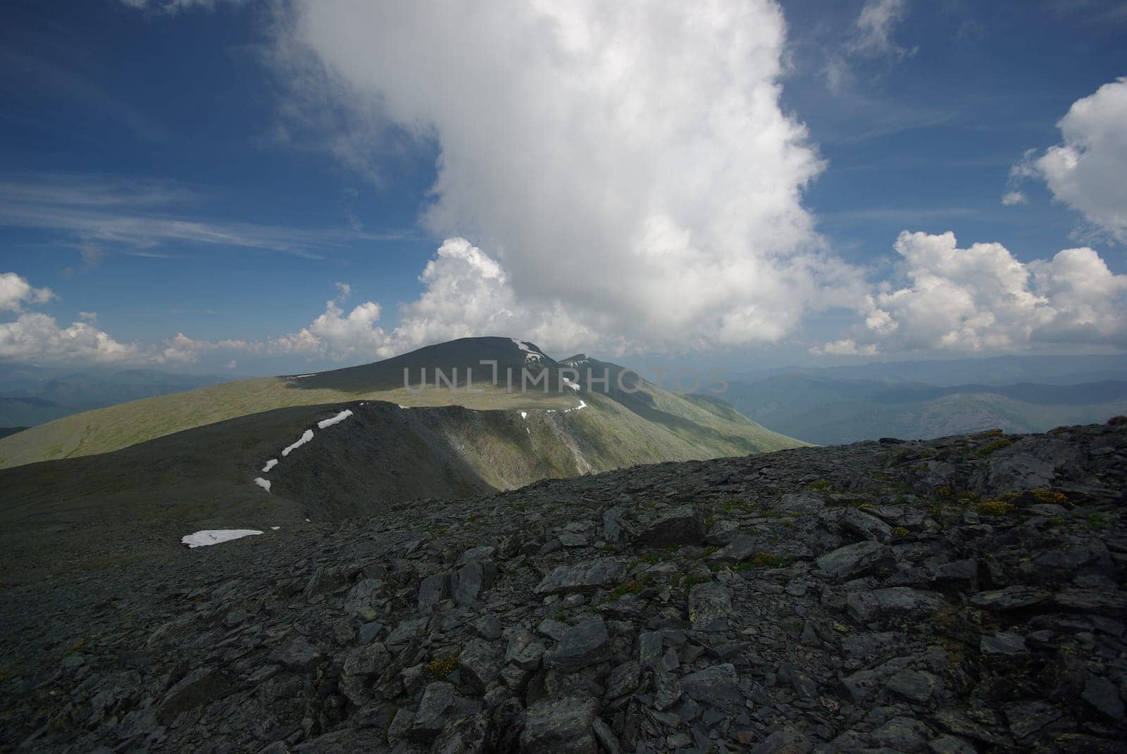 Mountain landscape. Highlands, the mountain peaks, gorges and valleys. The stones on the slopes.