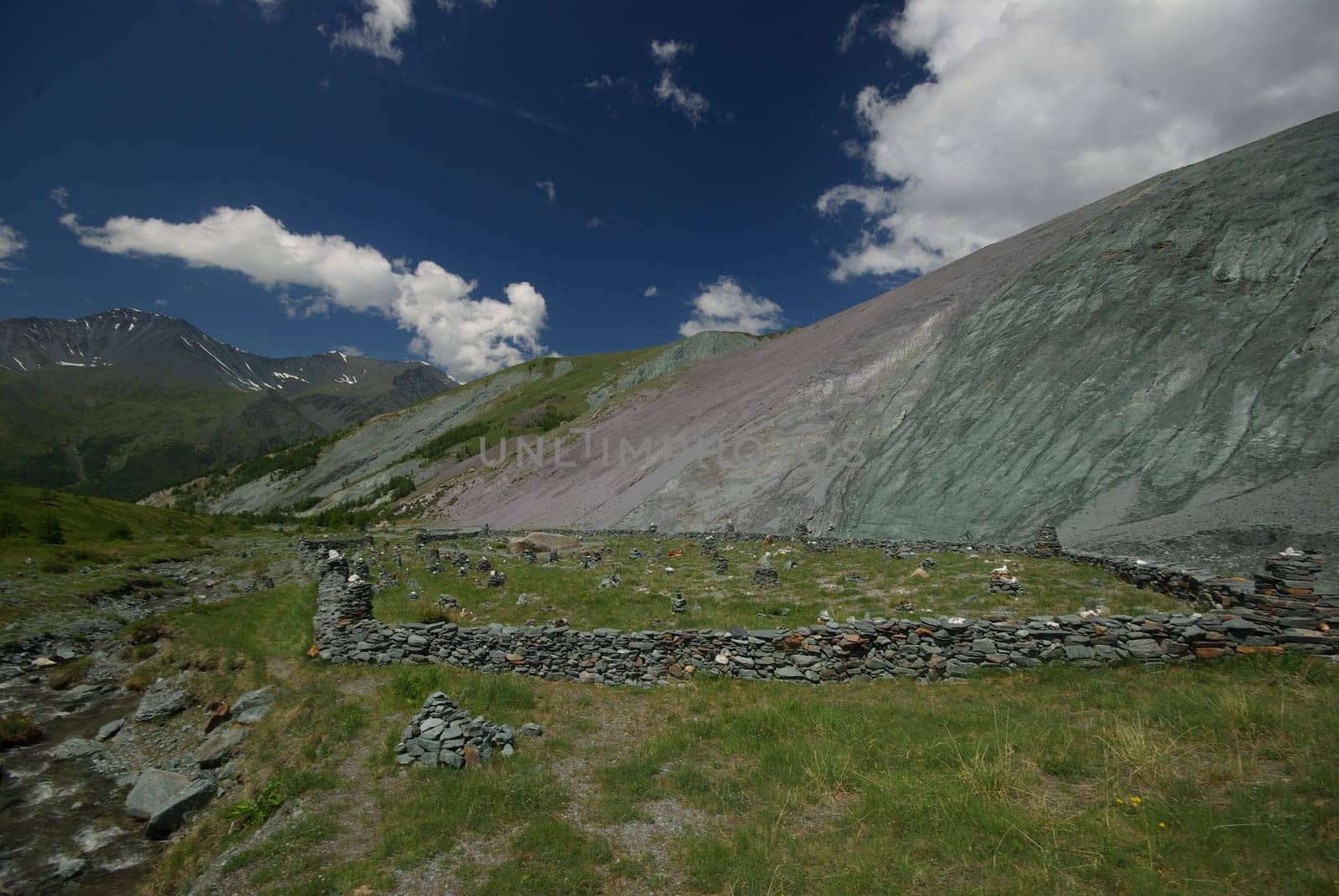 Mountain landscape. Highlands, the mountain peaks, gorges and valleys. The stones on the slopes.