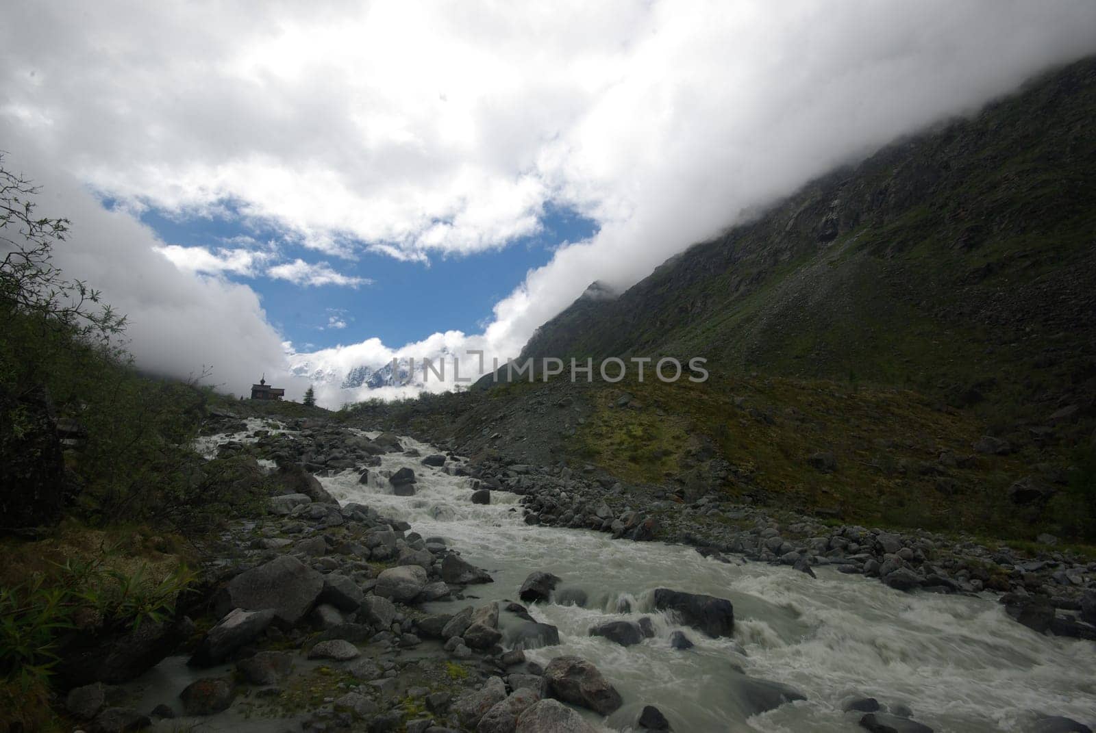 Mountain landscape. Highlands, the mountain peaks, gorges and valleys. The stones on the slopes.