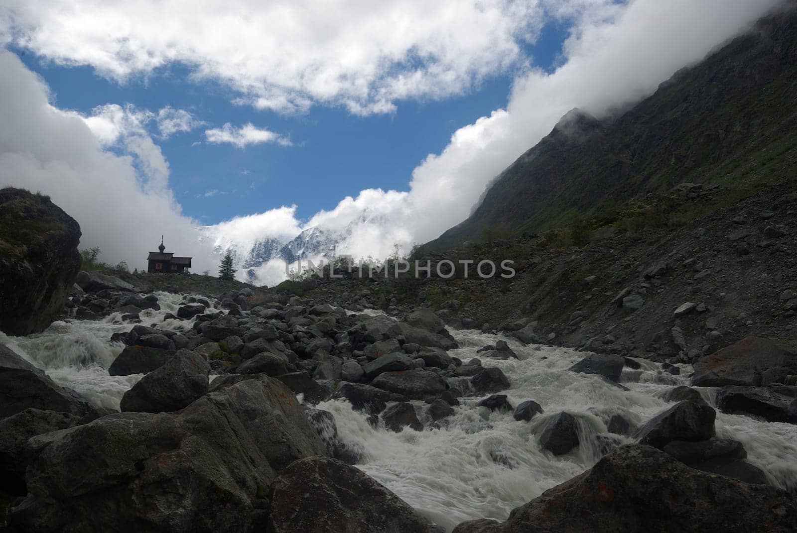 Mountain landscape. Highlands, the mountain peaks, gorges and valleys. The stones on the slopes.