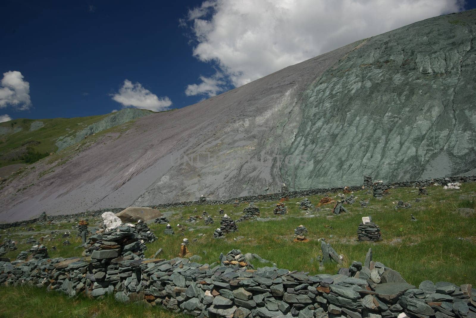 Mountain landscape. Highlands, the mountain peaks, gorges and valleys. The stones on the slopes.