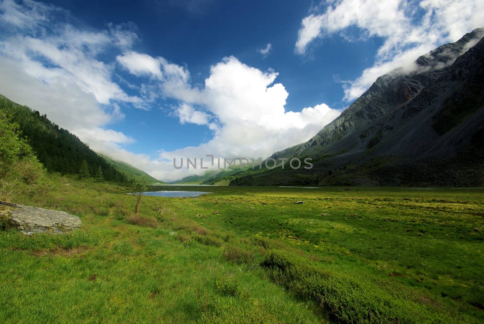 Mountain landscape. Highlands, the mountain peaks, gorges and valleys. The stones on the slopes.