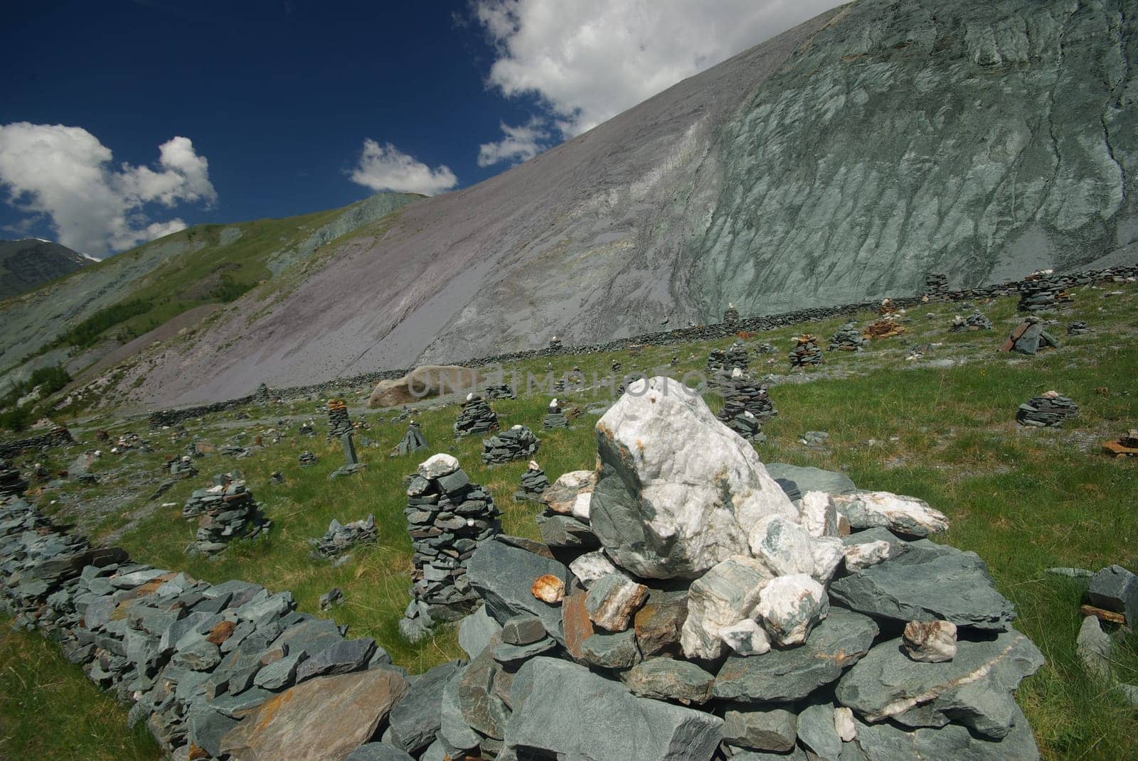 Mountain landscape. Highlands, the mountain peaks, gorges and valleys. The stones on the slopes.