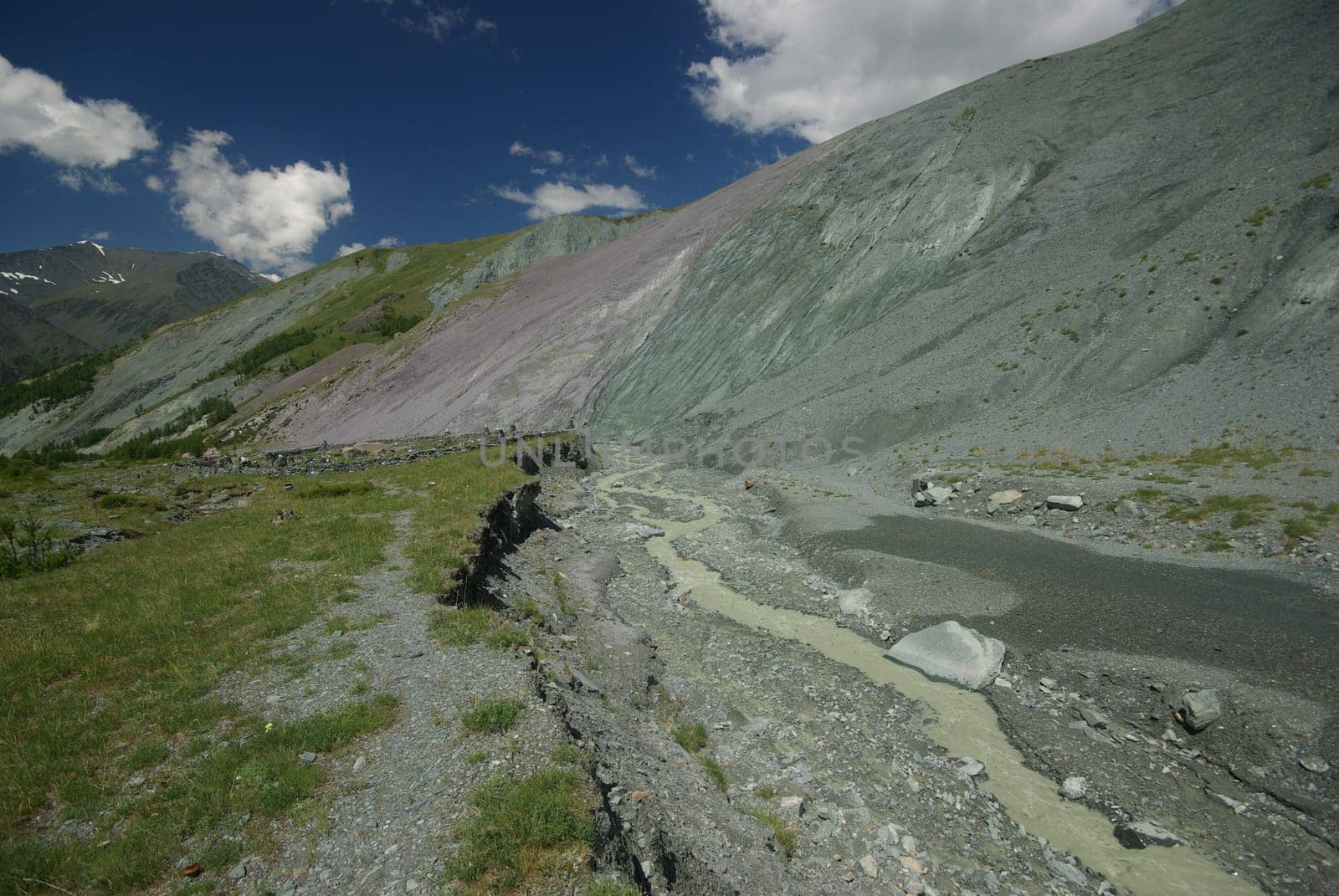 Mountain landscape. Highlands, the mountain peaks, gorges and valleys. The stones on the slopes.