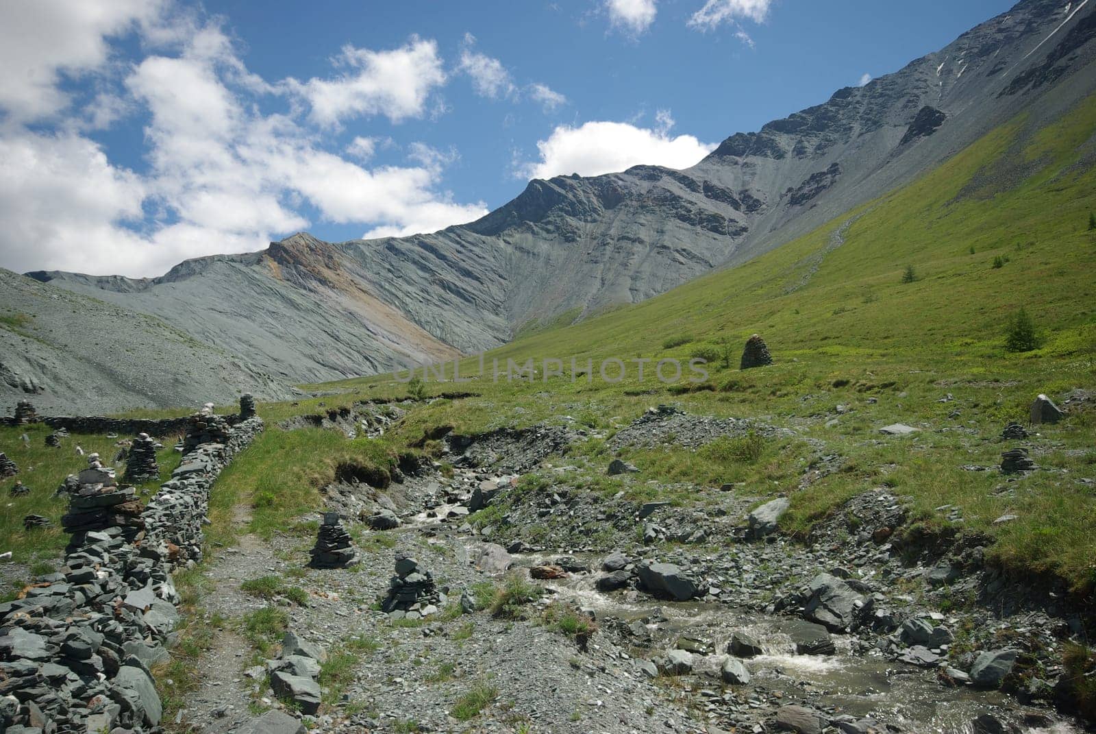 Mountain landscape. Highlands, the mountain peaks, gorges and valleys. The stones on the slopes.