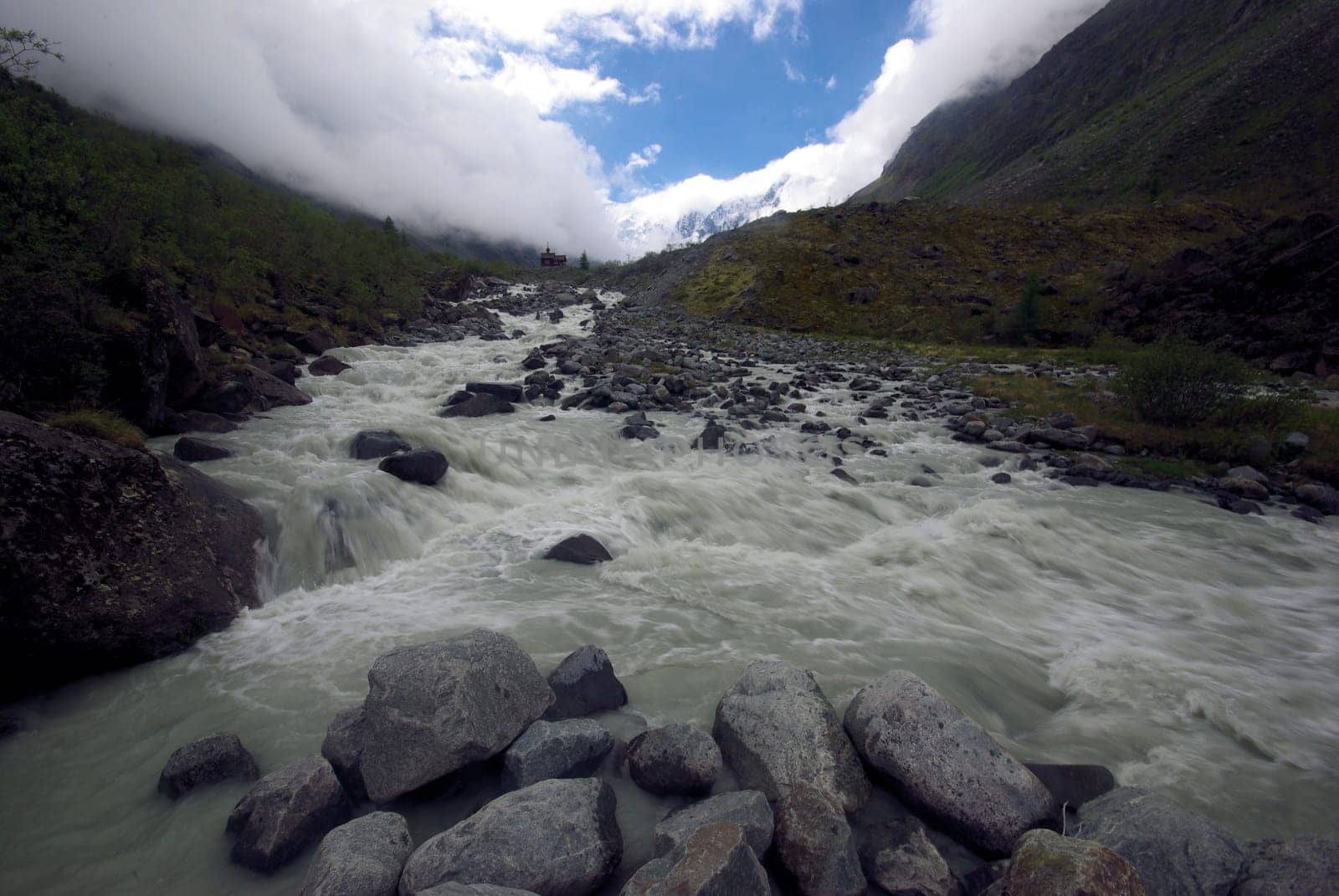 Mountain landscape. Highlands, the mountain peaks, gorges and valleys. The stones on the slopes.