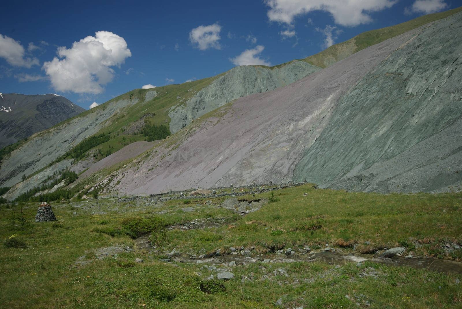 Mountain landscape. Highlands, the mountain peaks, gorges and valleys. The stones on the slopes.
