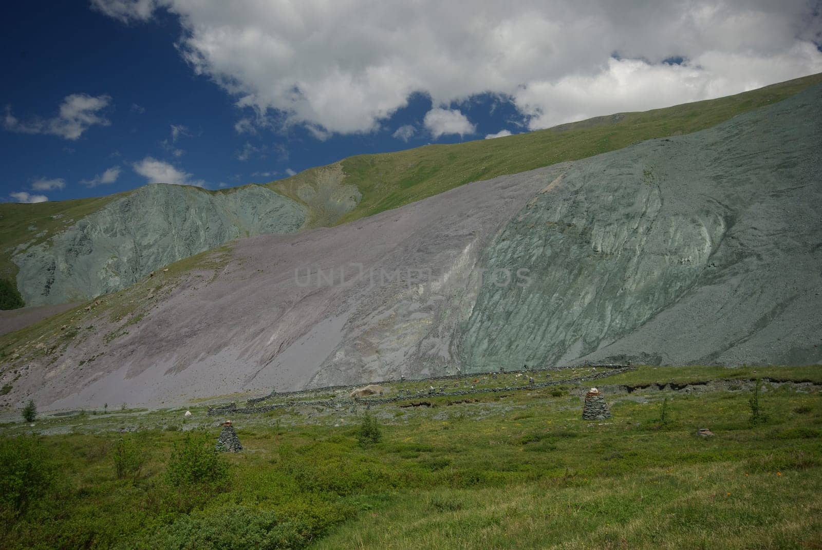 Mountain landscape. Highlands, the mountain peaks, gorges and valleys. The stones on the slopes.