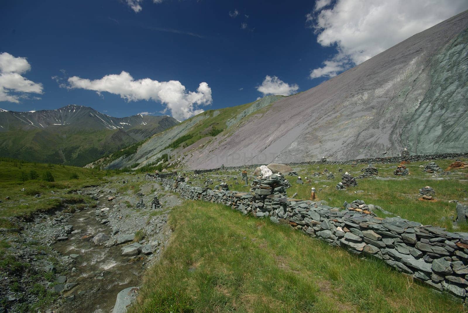 Mountain landscape. Highlands, the mountain peaks, gorges and valleys. The stones on the slopes.