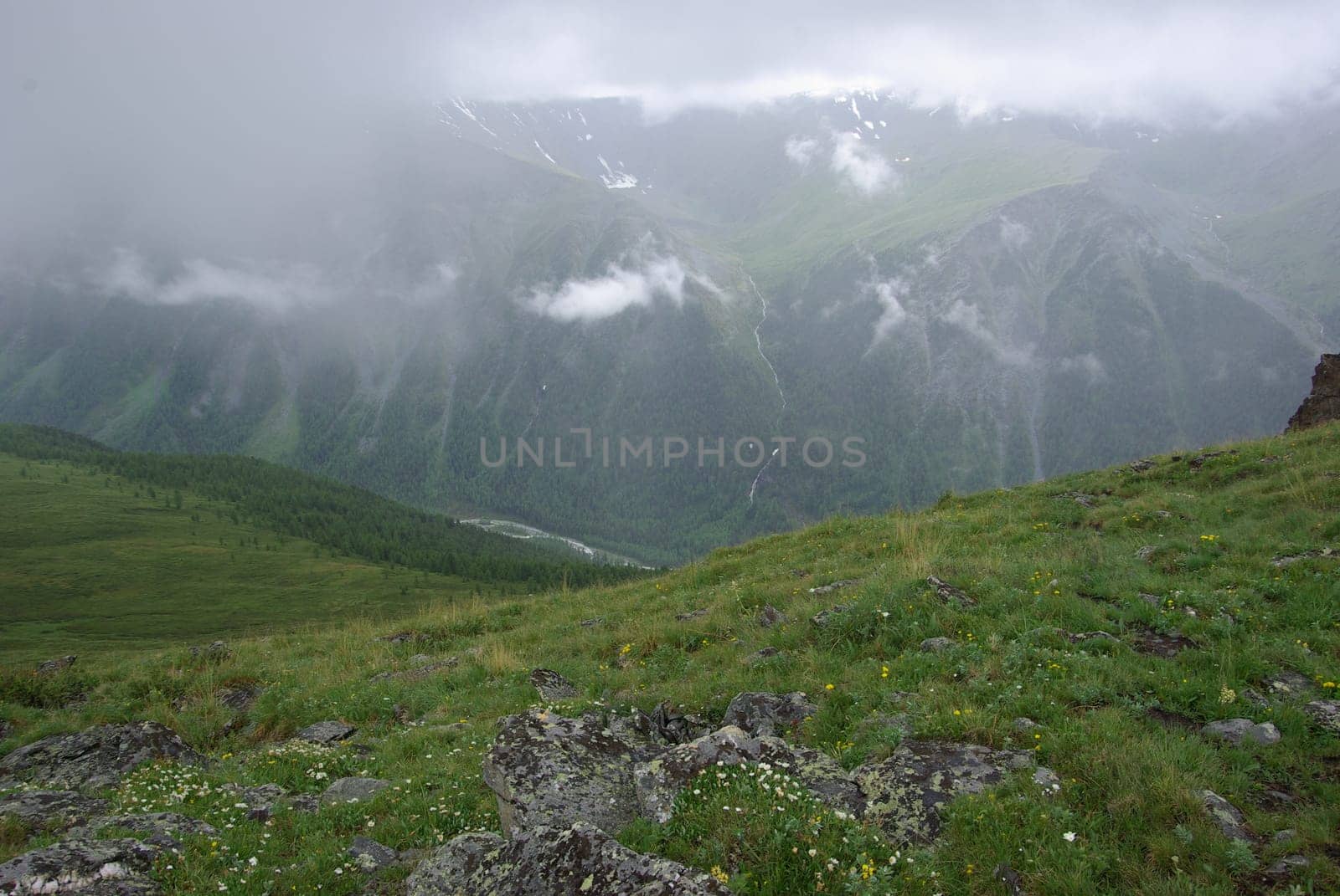 Mountain landscape. Highlands, the mountain peaks, gorges and valleys. The stones on the slopes.