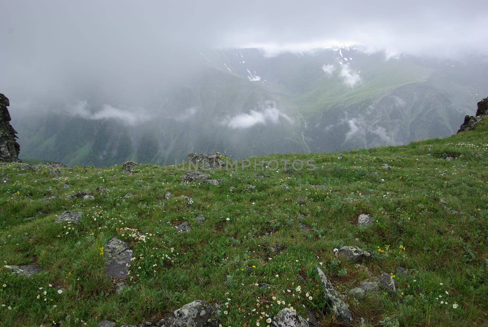 Mountain landscape. Highlands, the mountain peaks, gorges and valleys. The stones on the slopes.