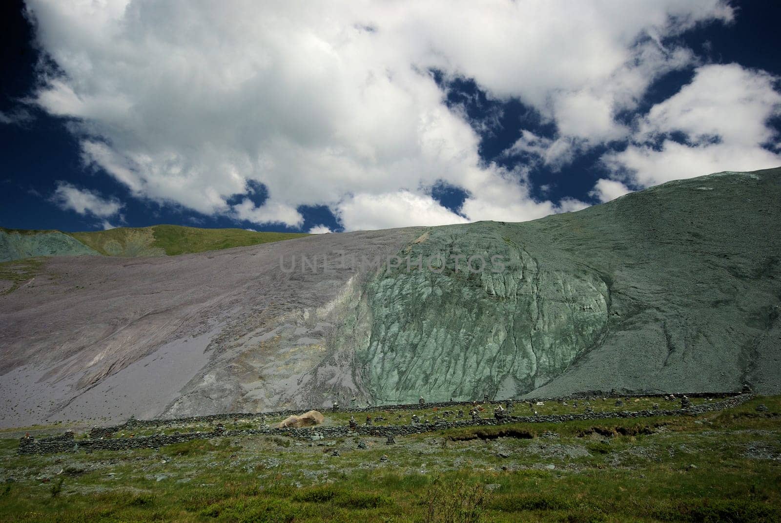 Mountain landscape. Highlands, the mountain peaks, gorges and valleys. The stones on the slopes.