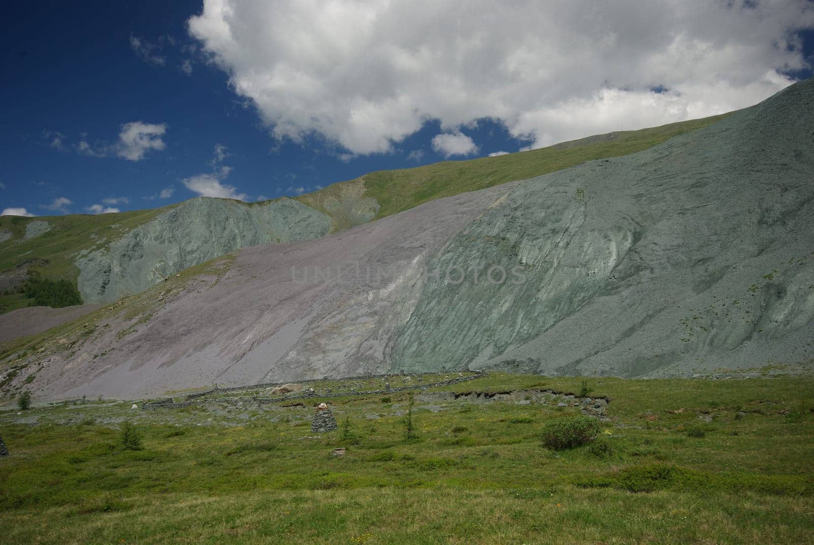 Mountain landscape. Highlands, the mountain peaks, gorges and valleys. The stones on the slopes.