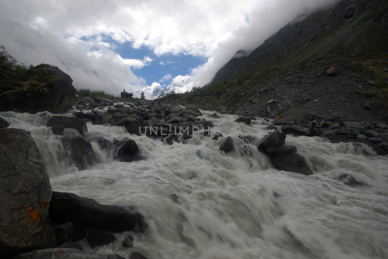 Mountain landscape. Highlands, the mountain peaks, gorges and valleys. The stones on the slopes.