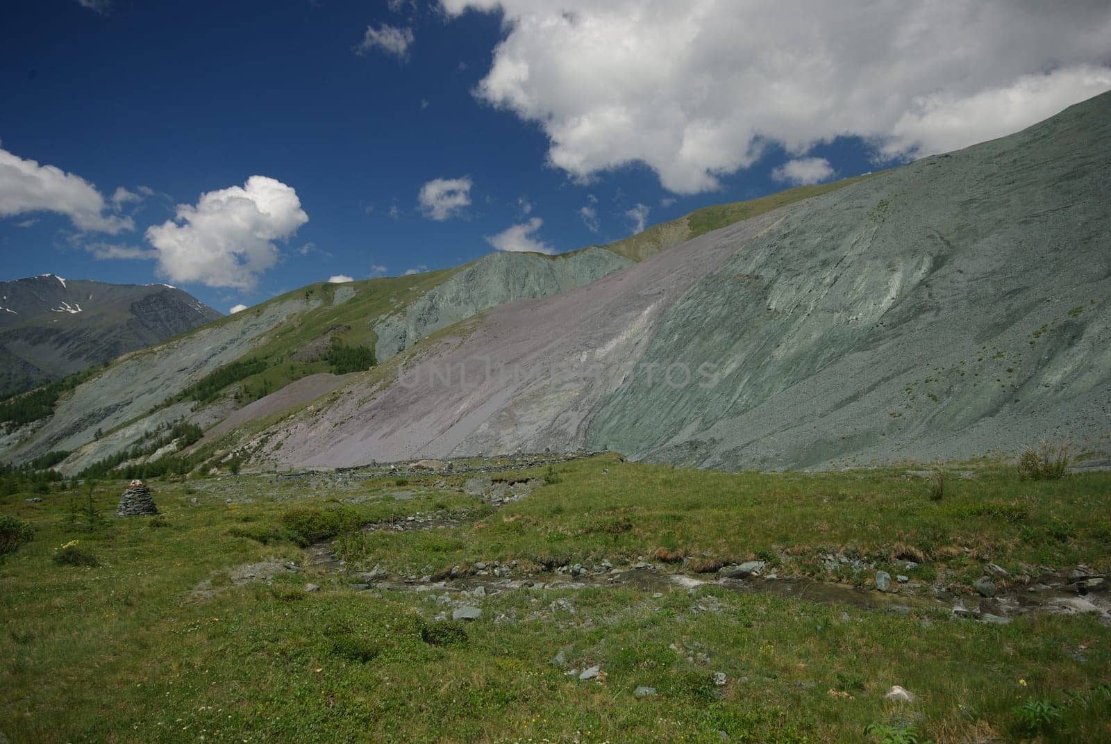 Mountain landscape. Highlands, the mountain peaks, gorges and valleys. The stones on the slopes.
