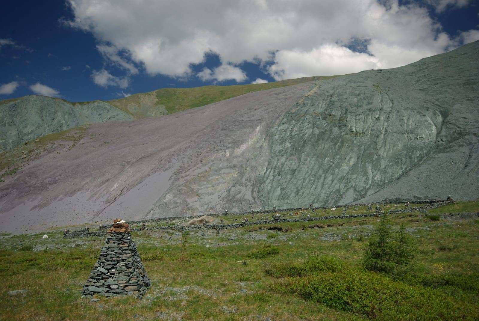 Mountain landscape. Highlands, the mountain peaks, gorges and valleys. The stones on the slopes.