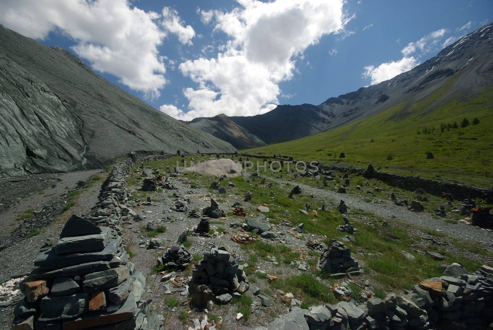 Mountain landscape. Highlands, the mountain peaks, gorges and valleys. The stones on the slopes.