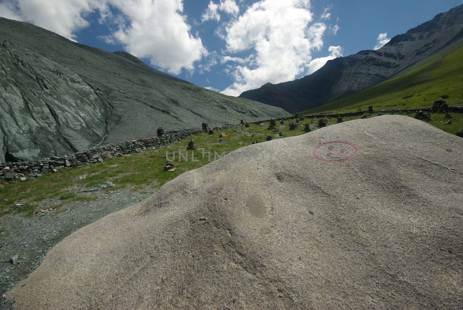 Mountain landscape. Highlands, the mountain peaks, gorges and valleys. The stones on the slopes.