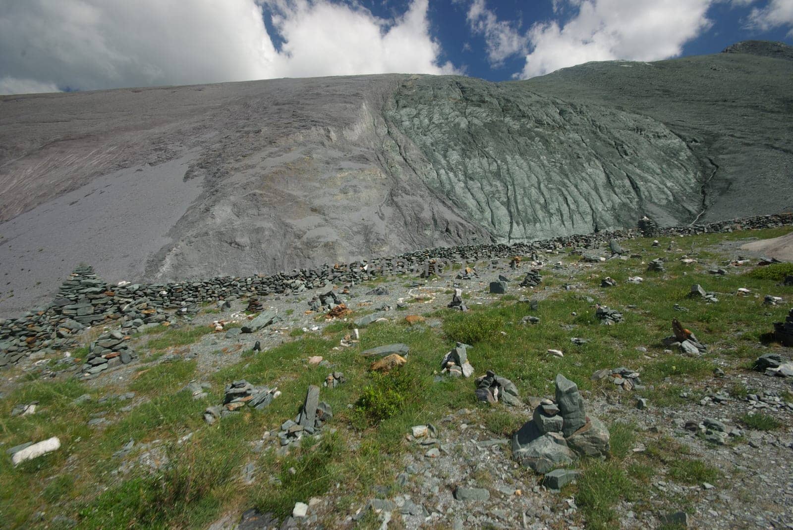 Mountain landscape. Highlands, the mountain peaks, gorges and valleys. The stones on the slopes.