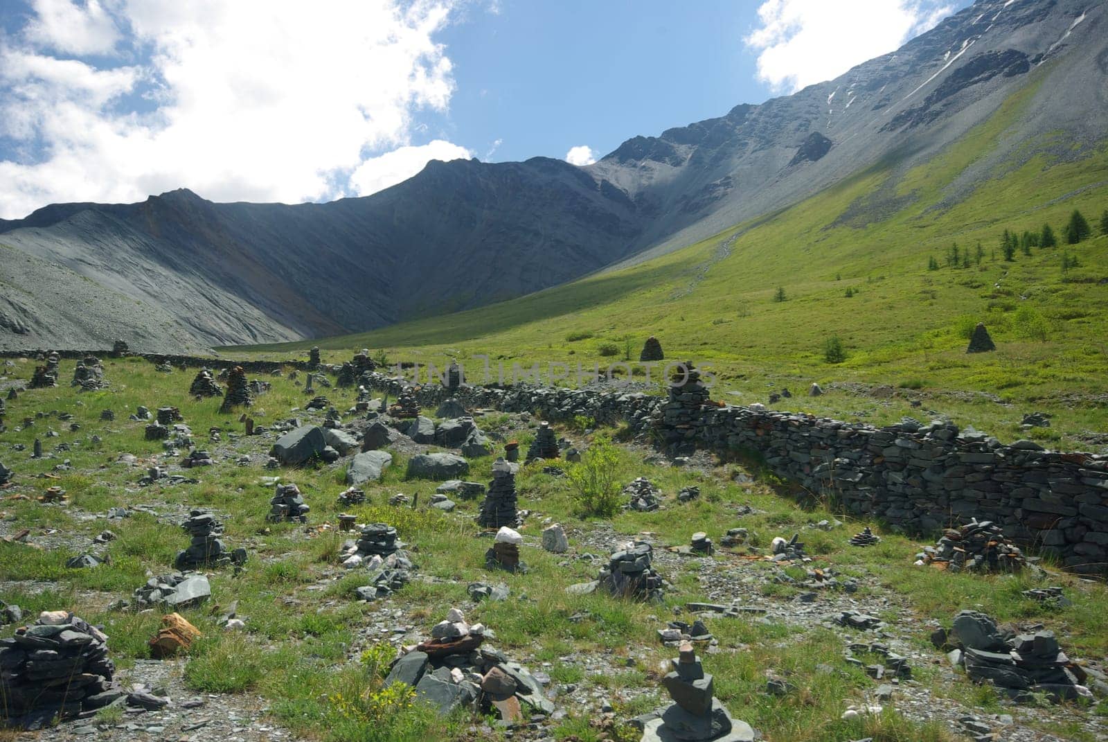 Mountain landscape. Highlands, the mountain peaks, gorges and valleys. The stones on the slopes.