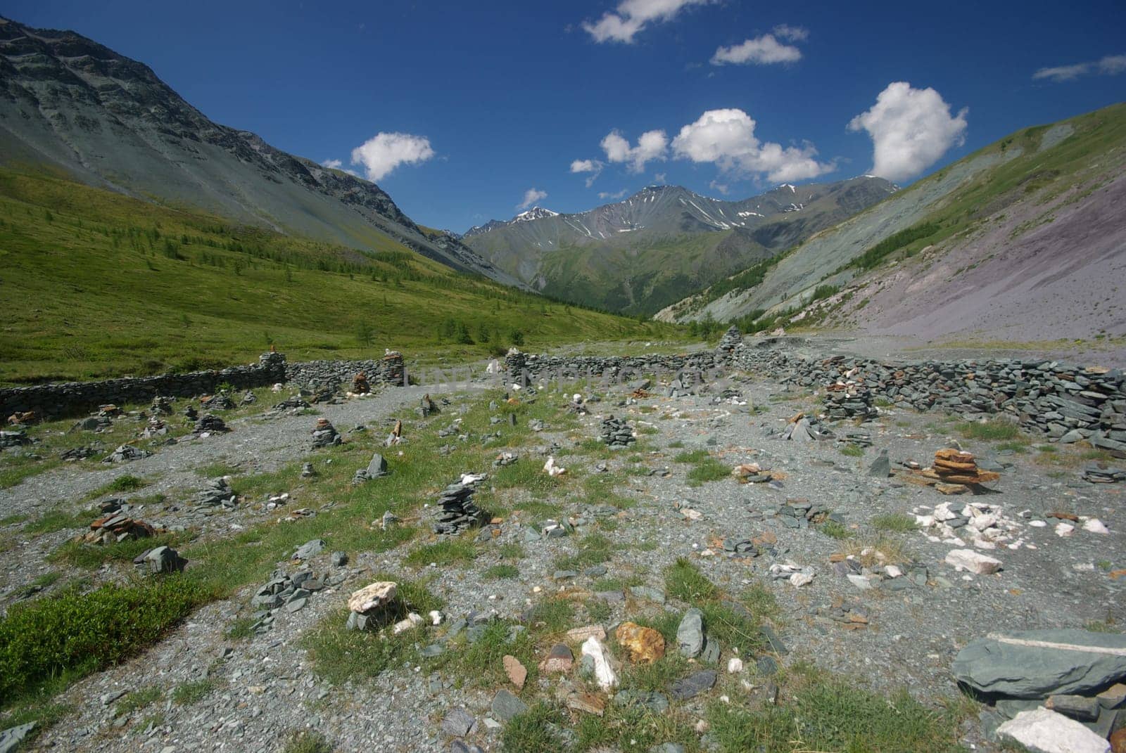 Mountain landscape. Highlands, the mountain peaks, gorges and valleys. The stones on the slopes.
