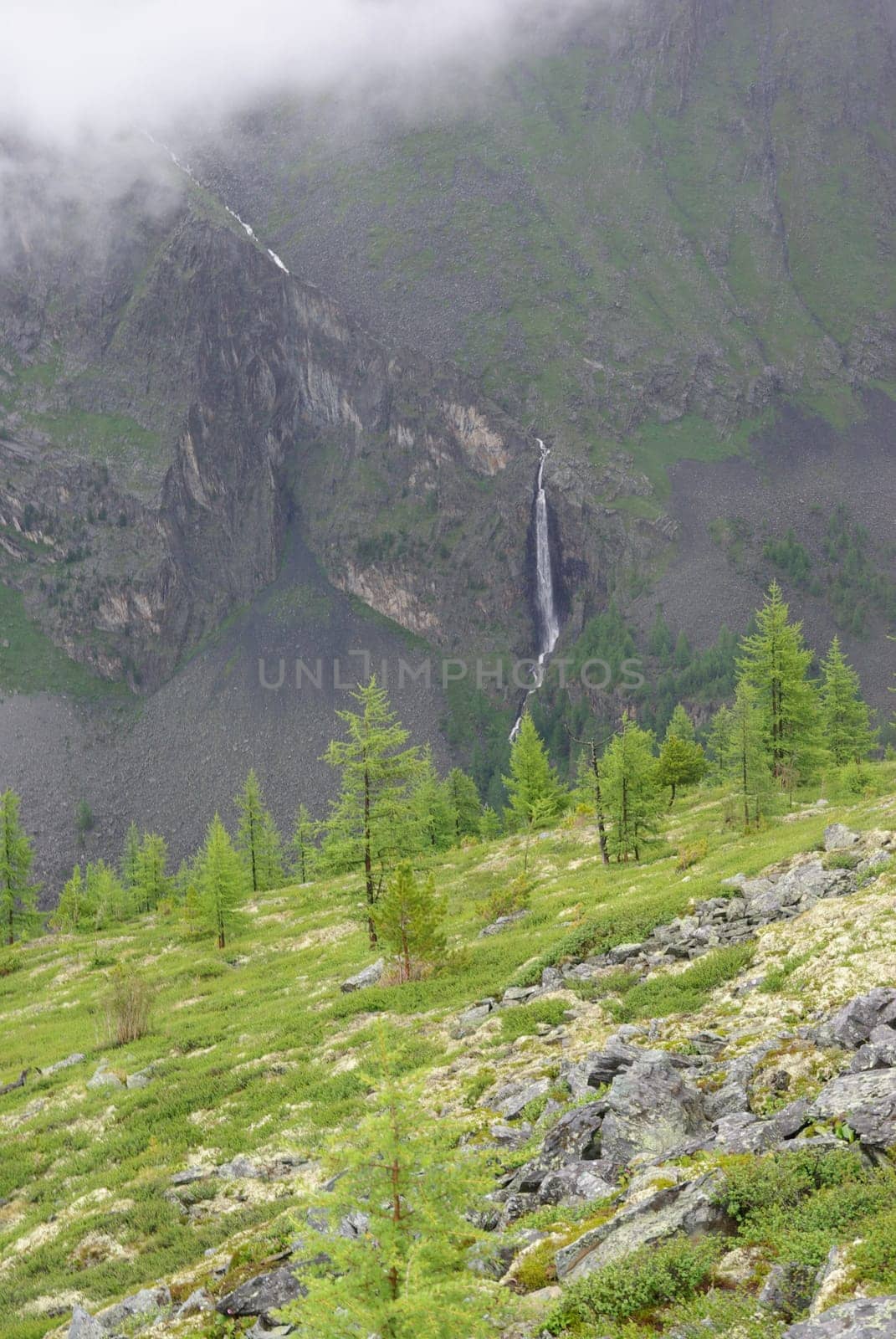 Mountain landscape. Highlands, the mountain peaks, gorges and valleys. The stones on the slopes.