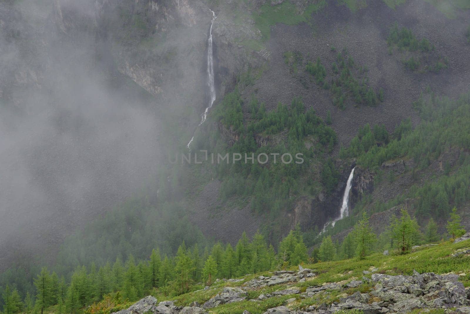 Mountain landscape. Highlands, the mountain peaks, gorges and valleys. The stones on the slopes.
