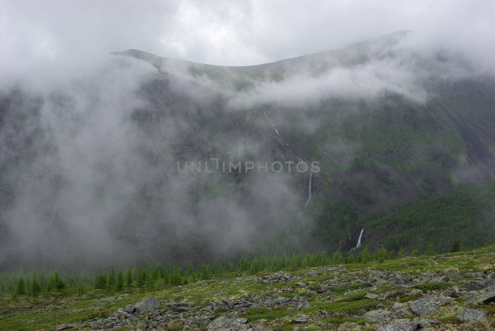 Mountain landscape. Highlands, the mountain peaks, gorges and valleys. The stones on the slopes.