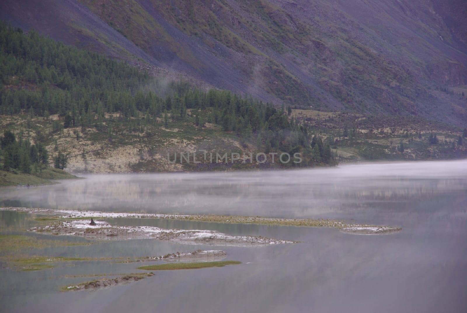 Mountain landscape. Highlands, the mountain peaks, gorges and valleys. The stones on the slopes.
