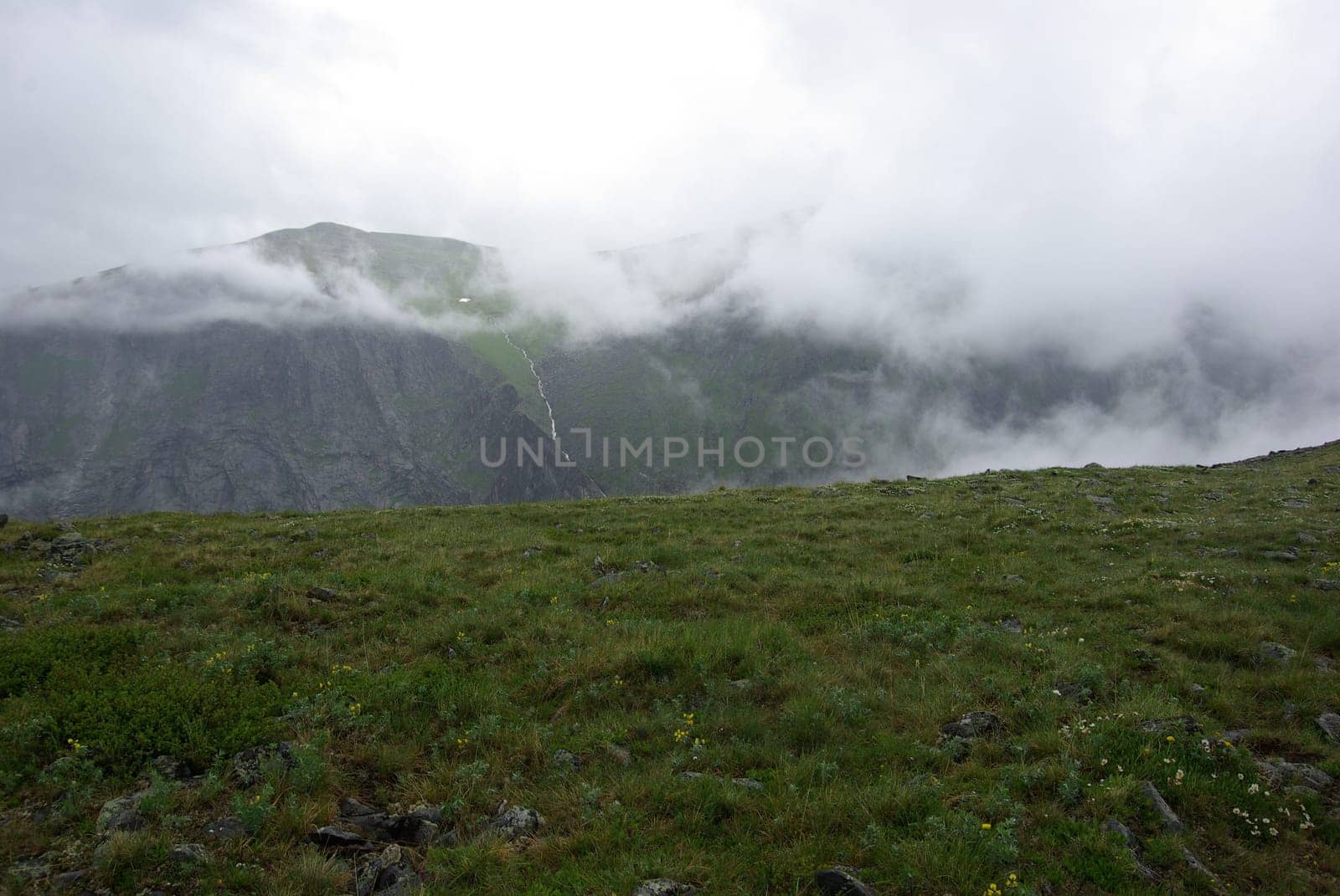 Mountain landscape. Highlands, the mountain peaks, gorges and valleys. The stones on the slopes.
