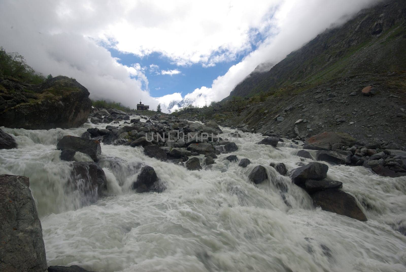 Mountain landscape. Highlands, the mountain peaks, gorges and valleys. The stones on the slopes.