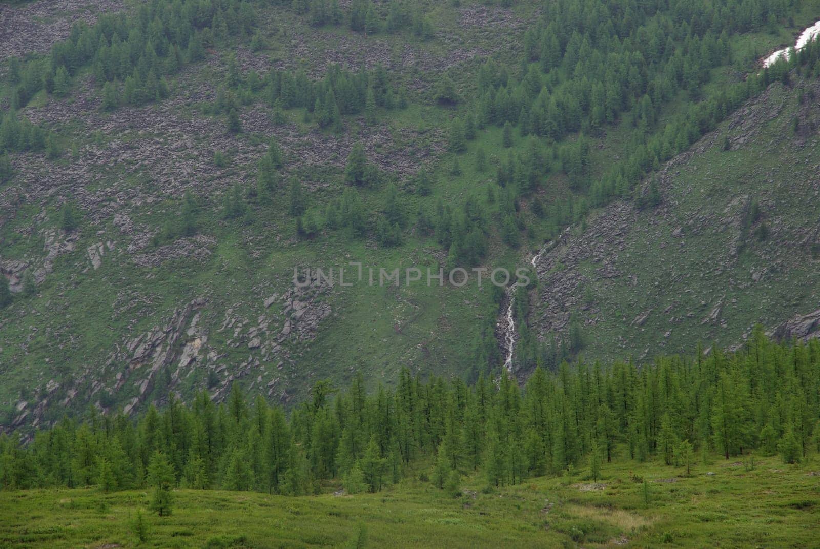Mountain landscape. Highlands, the mountain peaks, gorges and valleys. The stones on the slopes.