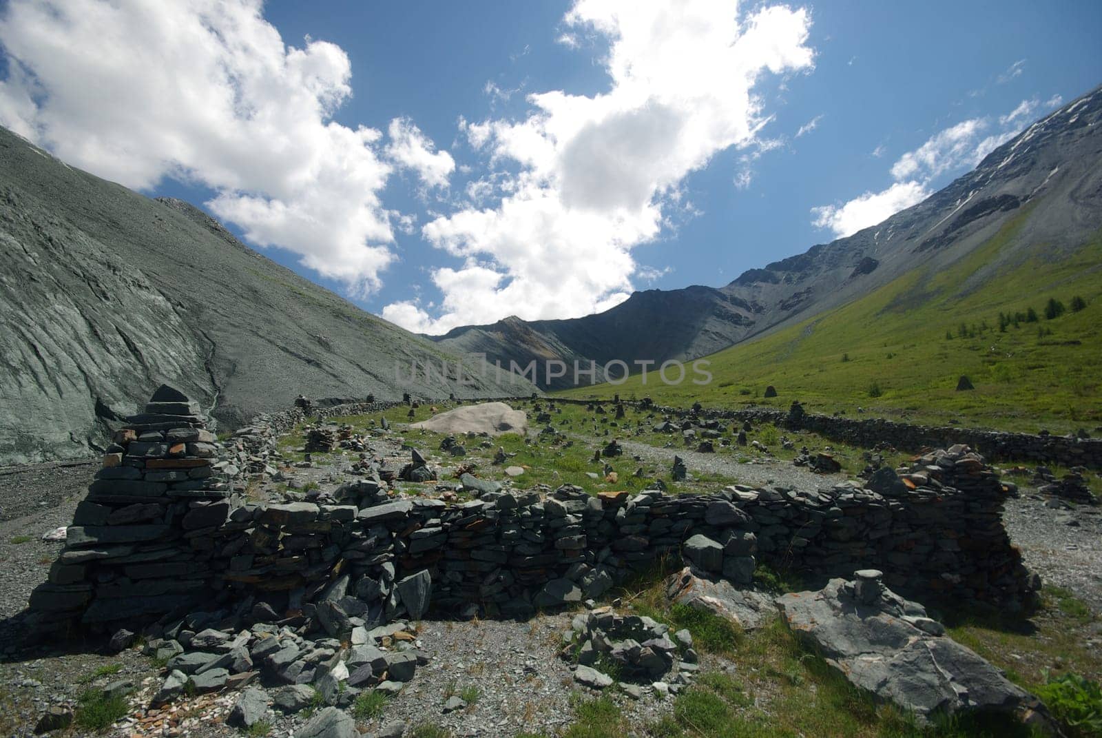Mountain landscape. Highlands, the mountain peaks, gorges and valleys. The stones on the slopes.