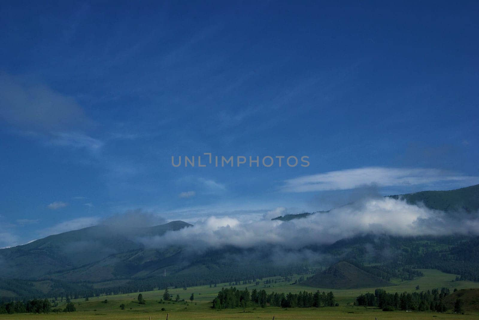 Mountain landscape. Highlands, the mountain peaks, gorges and valleys. The stones on the slopes.